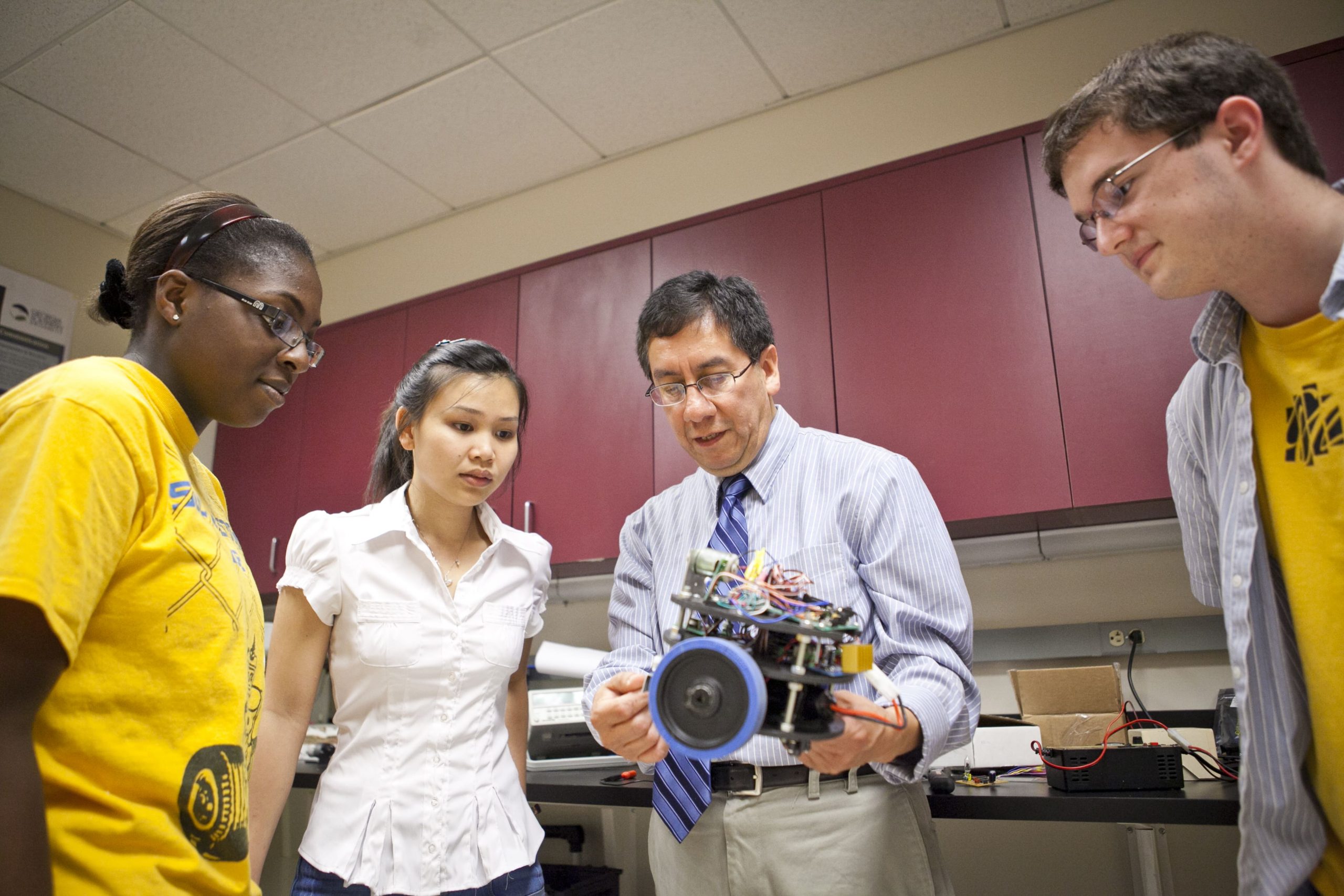Innovation Students learning from faculty about new technology